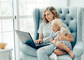 Young woman on computer with child